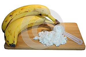 Bananas and whey protein powder on a wooden board photo