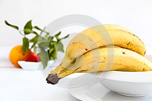 Bananas on white plate