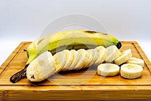 Bananas on a wooden cutting board. Calgary alberta Canada