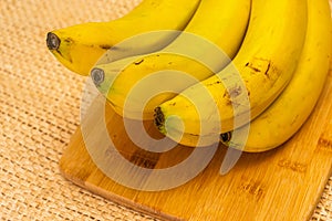 Bananas with yute texture in the background photo