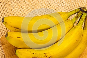 Bananas with yute texture in the background photo