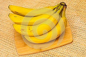 Bananas with yute texture in the background photo