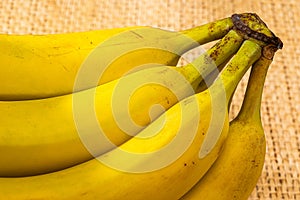 Bananas with yute texture in the background photo