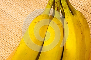 Bananas with yute texture in the background photo