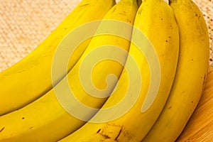 Bananas with yute texture in the background photo