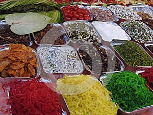 Banarasi paan ,betel leaf, betel nut and all indian colorful banarasi ingredients for sale photo
