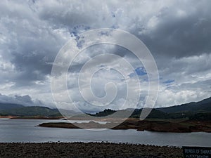 Banasura Sagar Dam: A Picturesque Canvas of Cloud-Adorned Skies, Mountains, and River Vistas in Wayanad