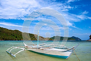 Banca boat on the beach of Vigan island snake Island in El nido region of Palawan in the Philippines