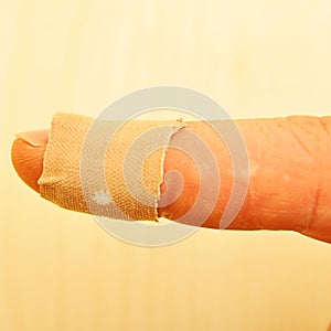 Band aid plaster of cloth wrapped in an injured thumb