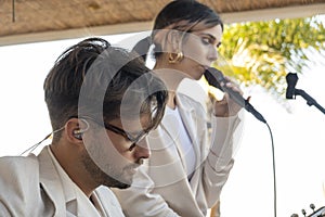 Band duo singer and guitar player in beach bar restaurant