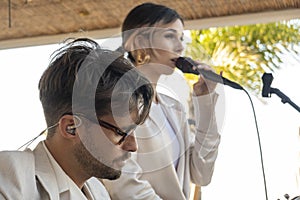 Band duo singer and guitar player in beach bar restaurant