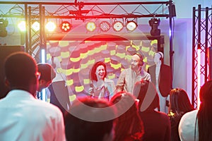 Band performing while crowd clubbing