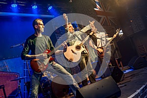 Band performs on stage, rock music concert in a nightclub photo