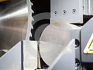 Band saw cutting steel bar