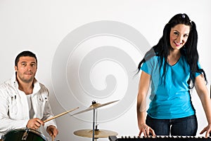 Band singing drums and organ