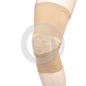 Bandage for fixing the injured knee of the human leg on a white background. medicine and sports. limb injury treatment