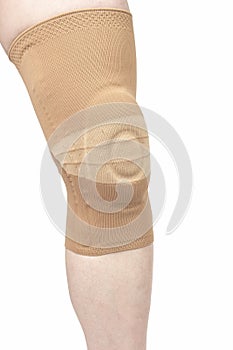 Bandage for fixing the injured knee of the human leg on a white background. medicine and sports. limb injury treatment