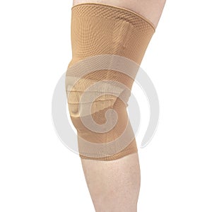 Bandage for fixing the injured knee of the human leg on a white background. medicine and sports. limb injury treatment