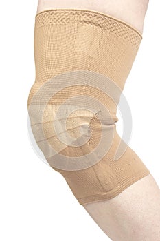 Bandage for fixing the injured knee of the human leg on a white background. medicine and sports. limb injury treatment