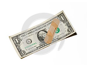 Bandage on one dollar bill on world financial economical crisis