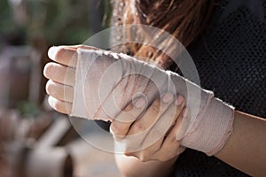 Bandaged hand in light and shadow