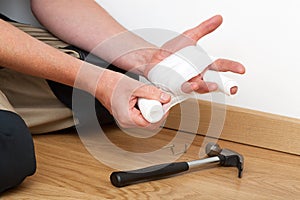 Bandaging injured hand photo