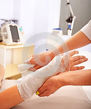 Bandaging patient in hospital.