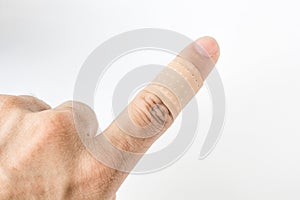 Bandaid on the index finger isolate background