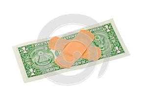 Bandaids on dollar bill