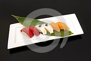 Three Flavors Classic Nigiri Tray, Truffled Butterfish, Marinated Salmon and Red Tuna photo