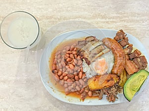 Bandeja Paisa and soursop drink photo