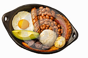 Bandeja paisa, typical dish at the AntioqueÃ±a region of Colombia. It consists of chicharrÃ³n fried pork belly, black pudding,
