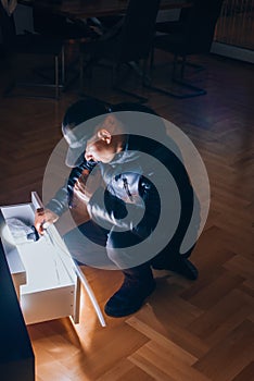 Bandit searching document in living room