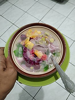 Bandung, Indonesia, April 20, 2021 : fruit soup with various fruit slices coupled with ice and milk adds to the delicious taste