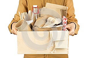 Baner with a courier holding a box with eco dishes for fast food and  on a white background.