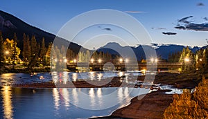 Banff Avenue Bridge over the bow river light up at summer night. Banff National Park.