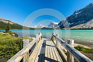 Banff National Park beautiful landscape. Bow Lake lakeshore trail and wooden bridge. Alberta, Canada.