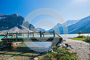 Banff National Park beautiful landscape. Bow Lake lakeshore trail and wooden bridge. Alberta, Canada.