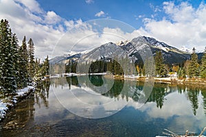 Banff National Park beautiful natural scenery in winter sunny day. Bow River. Town of Banff, Canadian Rockies.