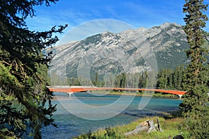 Banff National Park with Pedestrian Bridge over Glacial Bow River, Canadian Rocky Mountains, Alberta