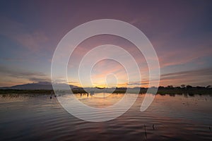 Bang Pra Reservoir dam. National park with reflection of river lake, mountain valley hills at sunset in Sri Racha, Chonburi,