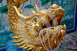 Bang Saen, Thailand: Gilded Dragon with Pearls