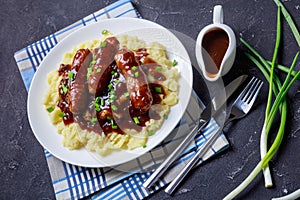 Bangers and Mash with Onion Gravy on a plate
