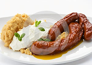 Bangers and mash over white background