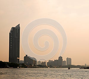 Bangkok Chao Phraya riverside scenery with ferris wheel