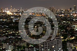 Bangkok city scrapers with high building at night time