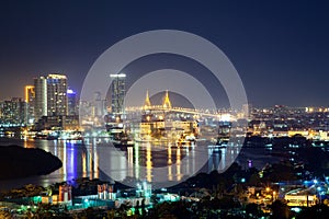 Bangkok cityscape. Bangkok night view of Bhumibol Bridge on Chao Phraya river and business district.
