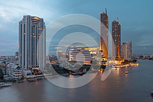 Bangkok Cityscape Business Administrative center with river view during sunset.