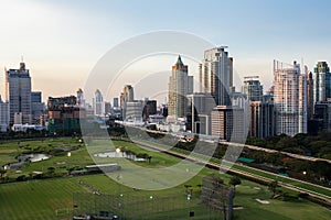 Bangkok Cityscape, Business district with Football Field at dusk