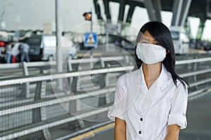 At bangkok intl airport with face mask